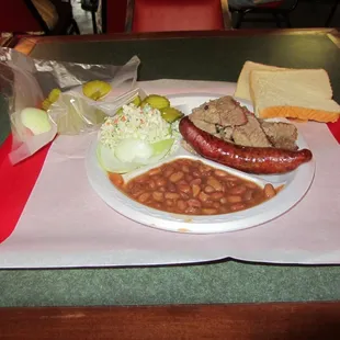 This is a two meat plate with double brisket and a link with some bread.  Link good.  Brisket, not so good.  Beans watery.