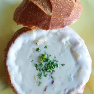 Clam Chowder Made from Scratch! Loaded with clams and potatoes. Freshly baked sourdough bread bowl from Village Bakery in Davis, CA