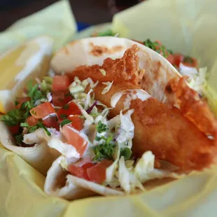 Fish Tacos - fried fish, thinly sliced cabbage, tomatoes &amp; cilantro and house sauce!