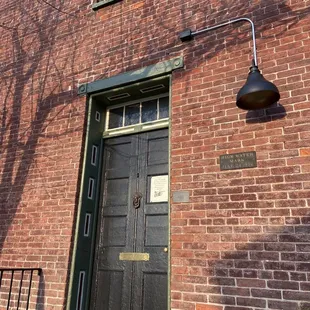 Door to go in.  If it's to windy; go to the other door.