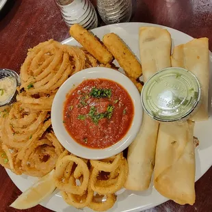 Appetizer sampler: onion rings, mozzarella sticks, calamari, southwestern egg rolls