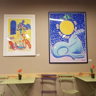 tables, chairs, and artwork