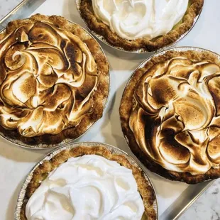 three pies with meringue toppings