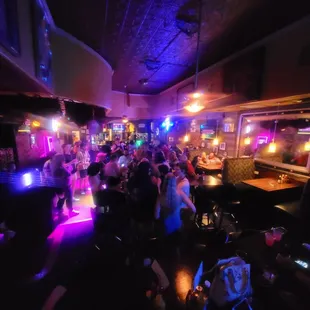 a crowd of people at a bar