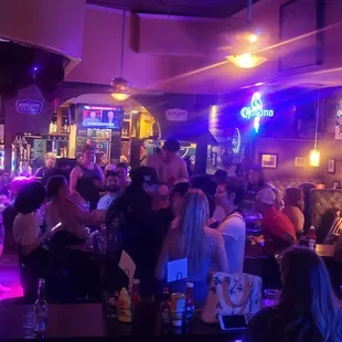 a crowd of people at a bar