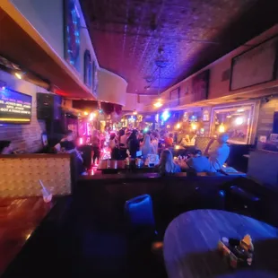 a crowd of people sitting at tables