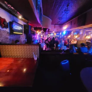 a crowd of people at a bar