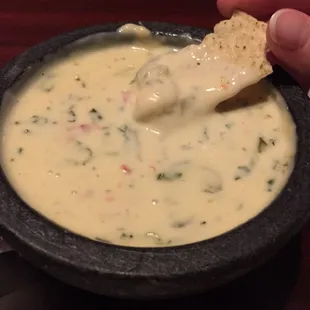 Their specialty queso.... You won't want that yellow crap from *insert restaurants with plain cheese dip* after you have this.