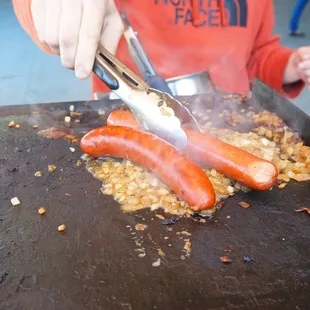 Sizzzlingg hot weenies!! 1/4 Pound All Beef Dawg next to a Louisiana Hot Link!