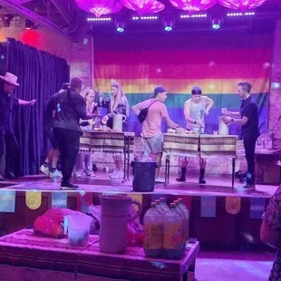 a stage with umbrellas and people