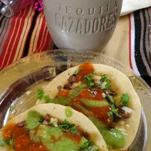 a plate of tacos and a cup of coffee