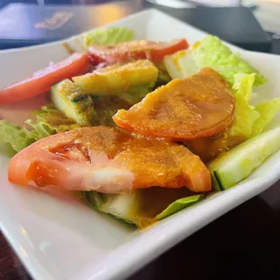 Rain salad - lettuce, sliced tomatoes and cucumber on a homemade ginger dressing ($4.95)