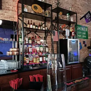 a bar with a brick wall