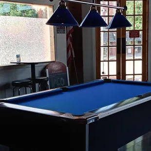a pool table with a blue cloth