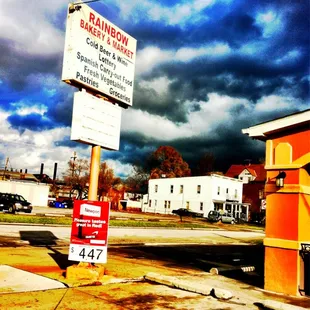 a bright orange building with a sign that says baking now