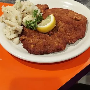 The schnitzel with potato salad and red cabbage.