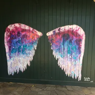 You can stand in front of this painted wall and be an angel