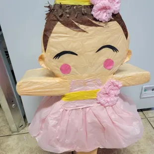 a little girl in a pink dress