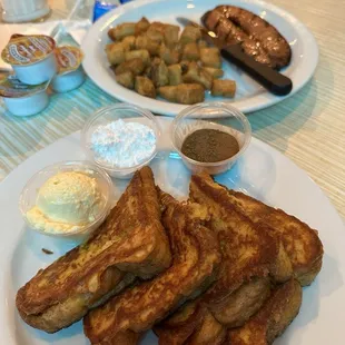 French toast with a side of cottage potatoes and andouille sausage