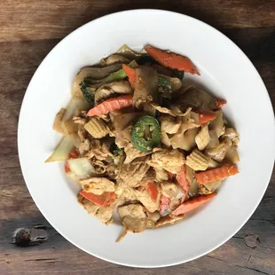 a plate of food on a wooden table
