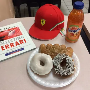 Enjoying a Snapple "Mango Madness" and tasty doughnuts while I read a book by Keith Martin "Collecting Ferrari"