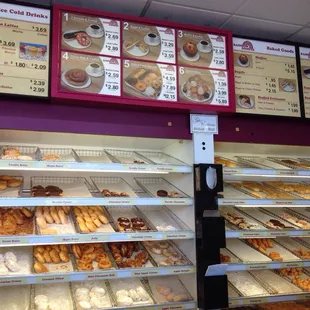 a variety of donuts in a display case