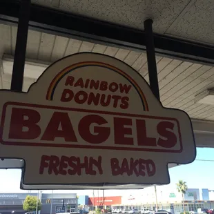 a sign for bagels freshin baked