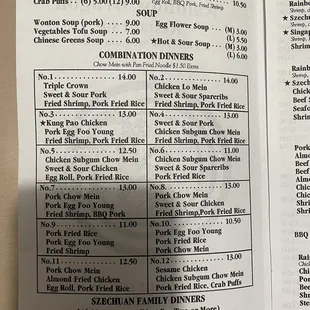 a hand holding a menu