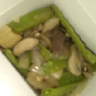 beef and vegetables in a white container