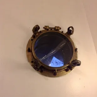 Porthole in the men's restroom.