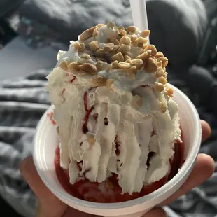 a hand holding a dessert