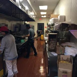 two people working in a restaurant kitchen