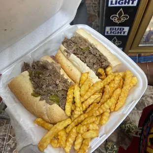 a person holding a container of food