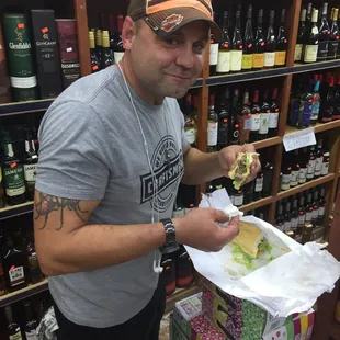 Our friend Terrell enjoying his cheese burger poboy on the spot..,