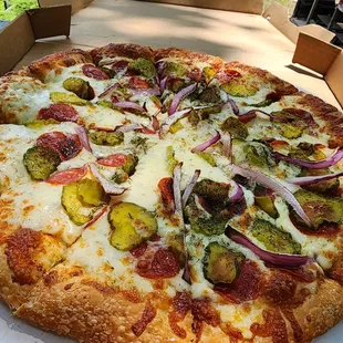Dill pickle pizza with pepperoni and onions