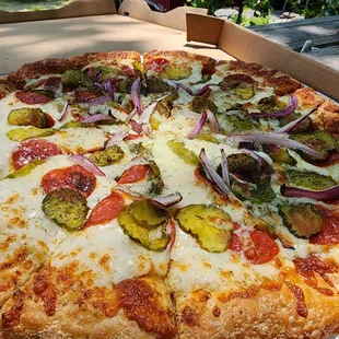 Dill pickle pizza with pepperoni and onions