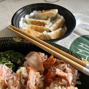 a bowl of food and chopsticks