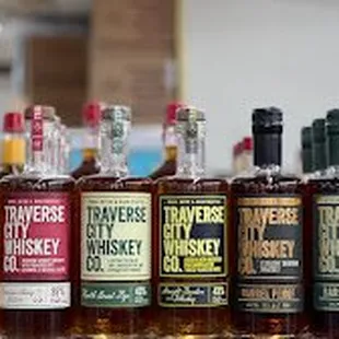 a row of bottles of whiskey