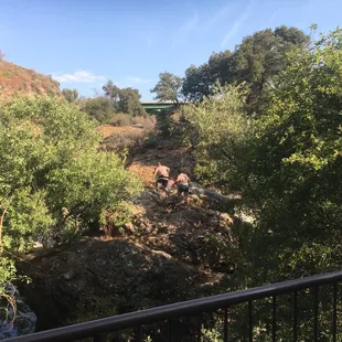 Climbing up to jump off rock