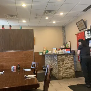 a woman standing at a table
