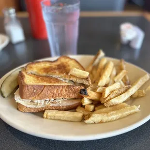 Bacon and Swiss Sandwich and fries.