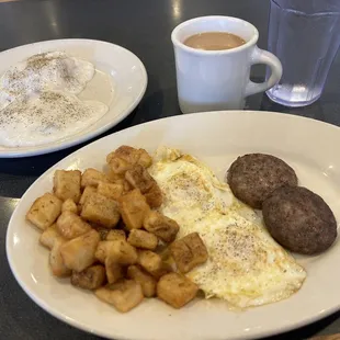 Eggs, sausage, potatoes, biscuits and gravy, coffee.