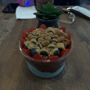 blue magic and açaí with granola strawberries blueberry and peanut better