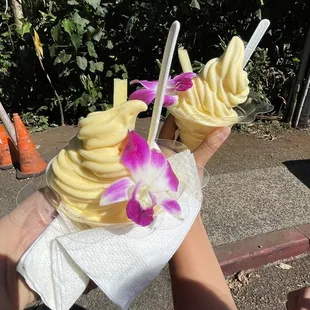 a person holding a bowl of ice cream
