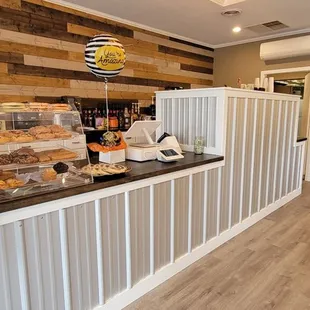 a woman standing in front of a counter