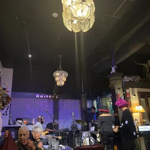 a group of people sitting in a restaurant