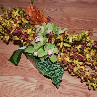 Tropicals can be made into lavish centerpieces. This one made especially for a long table.