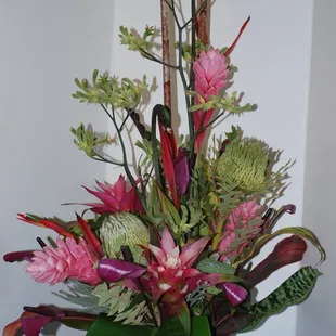 Tropical arrangements can be made into interesting artistic pieces using more than just sticks and dried bamboo.