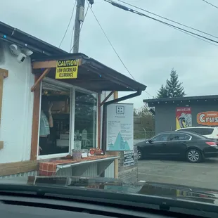 a car parked in front of a coffee shop