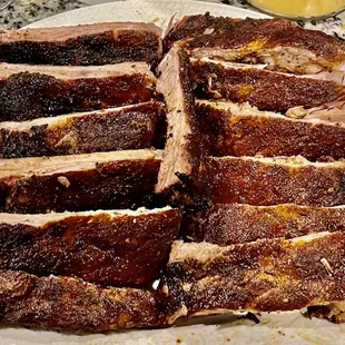 a plate of ribs on a granite countertop